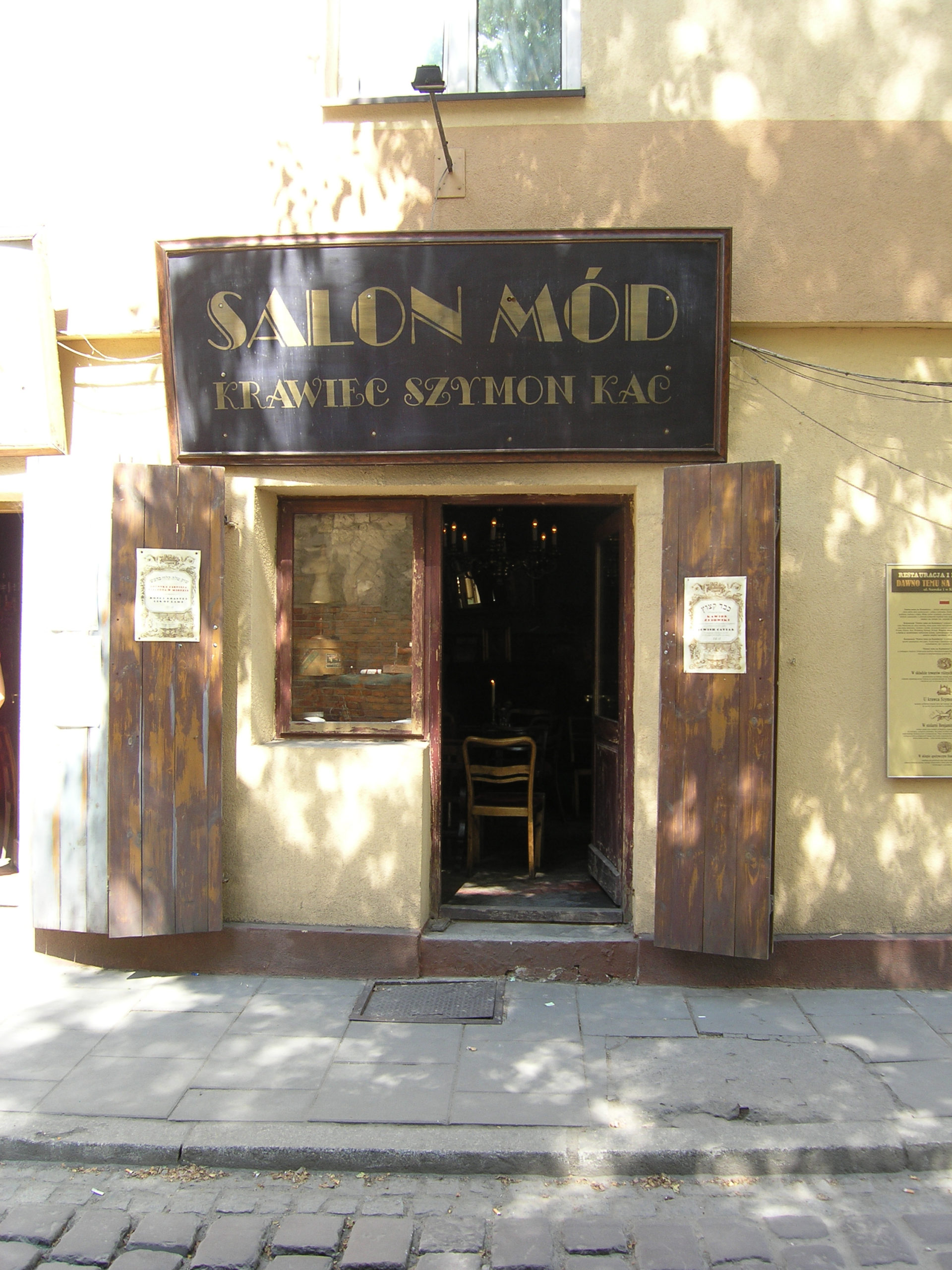 Kraków salon mód stary szyld